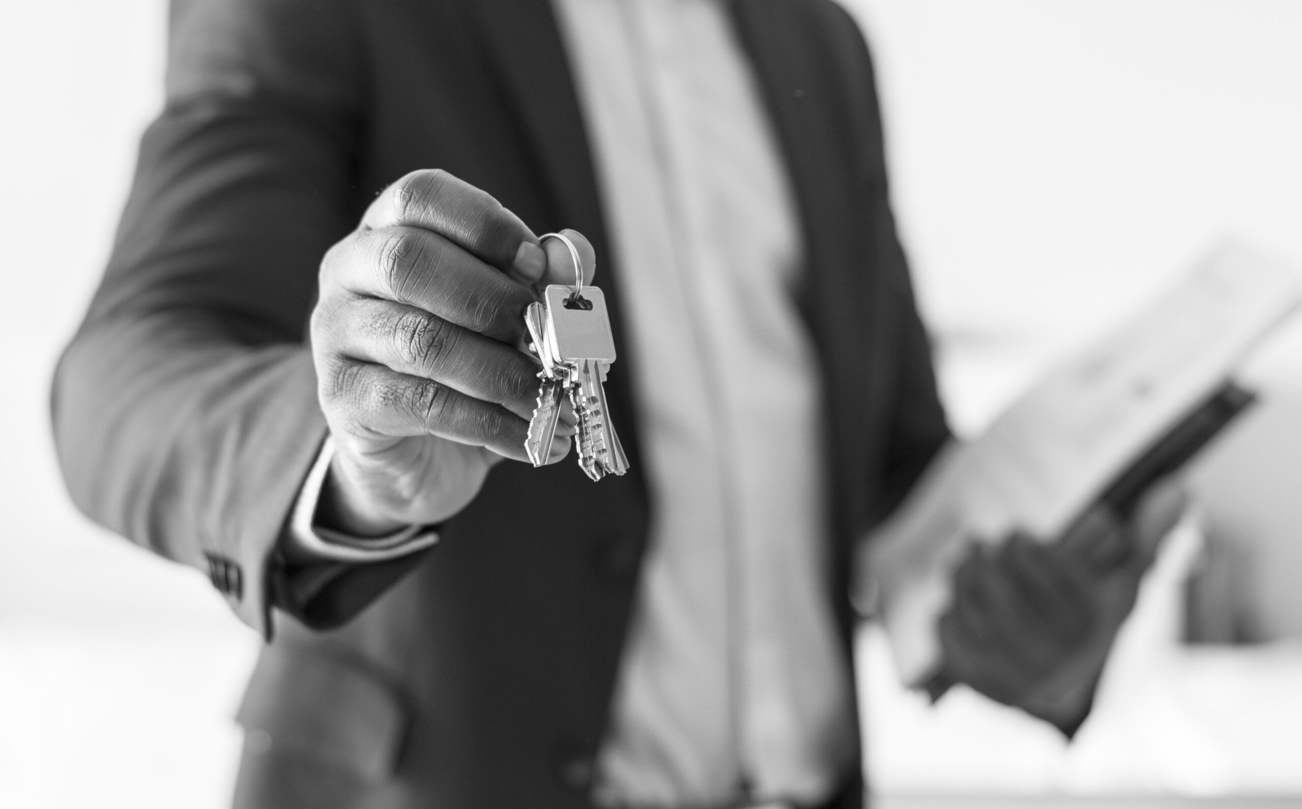 real estate agent handing the house key